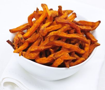 Closeup of sweet potato or yam fries in white bowl