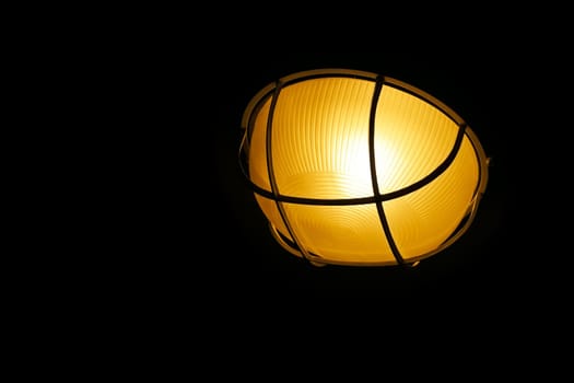 Yellow lantern duty lighting isolated on a black background
