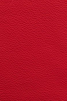 Red natural leather background or texture close up
