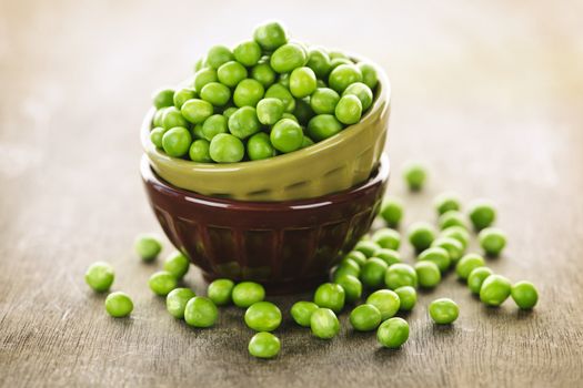 Bowl full of fresh green organic green peas