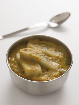 close up of a bowl of eggplant curry