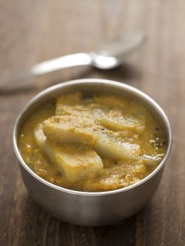 close up of a bowl of eggplant curry