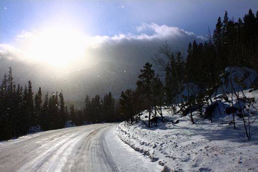 Snowstorm scene on a road through the Colorado Rockies. 