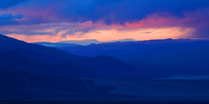 Sunset over the vast open landscape of Death Valley in California.