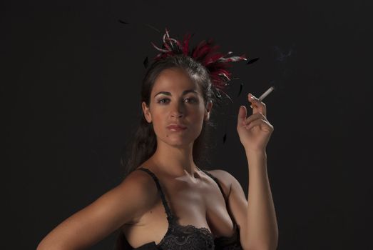 Cabaret girl  in a  cool attitude with a cigarette 