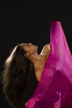 Studio shot of a dancer covering herself wiht a headscarf