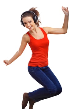 Happy smiling girl dancing and listening to music