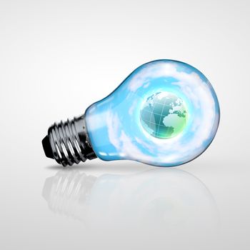 Electric light bulb and our planet inside it as symbol of green energy