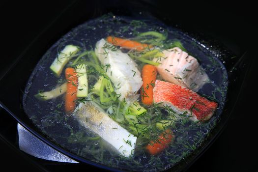 Tasty soup of a fish with vegetable marrows and carrots