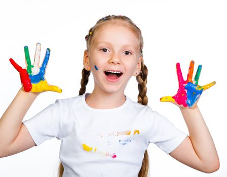 little girl with hands in paint on a white background