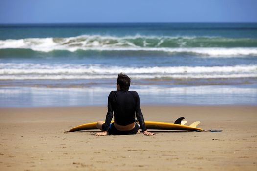 Surfer on a coastline expecting the big wave. Bali
