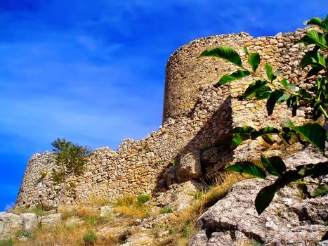 The ancient Genoese fortress in Crimea against the blue sky