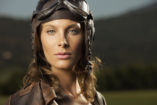 Portrait of young woman airplane pilot