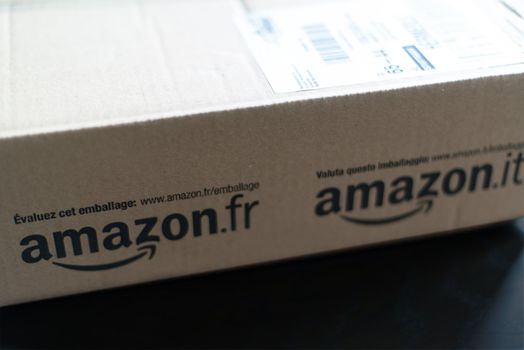 STUTTGART - SEPTEMBER 2: An Amazon.com parcel waiting on a table in a flat for being unpacked on September 2, 2012 in Stuttgart, Germany. Amazon.com is delivering thousands of parcels every day to German households.