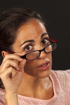 A nerd female giving the camera a reproachful look