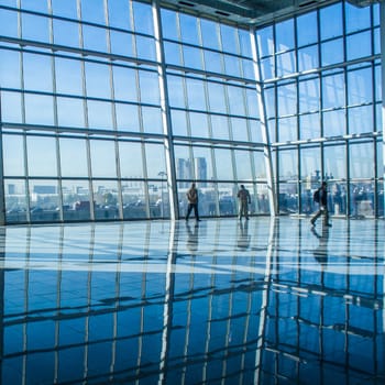 People silhouettes at office building. Blue color.