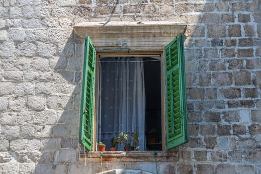 A window of a stony house in old town