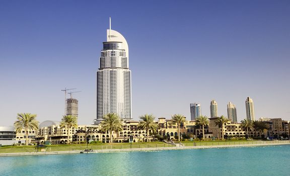 DUBAI, UAE - FEB 02: The Address Hotel in the downtown Dubai area overlooks the famous dancing fountains, taken on February 2, 2012 in Dubai. The hotel is surrounded by a mall, hotels and Burj Khalifa