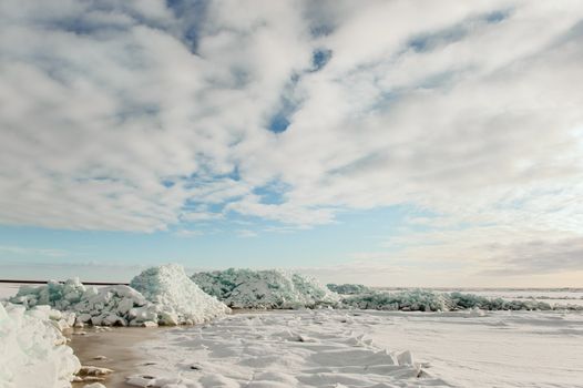 Winter Ladoga Lake. Ice, snow, clouds ... Russia