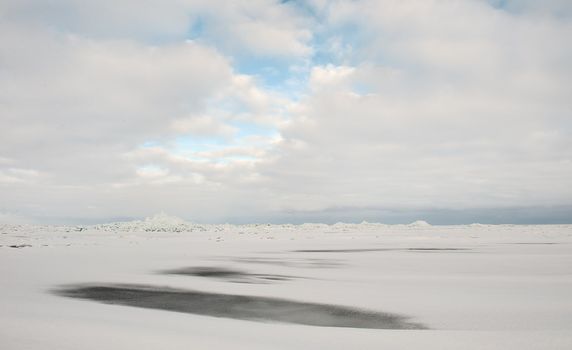 Winter Ladoga Lake. Ice, snow, clouds ... Russia