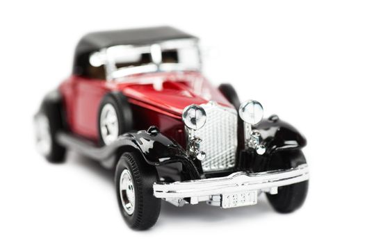 Macro view of toy car over white background