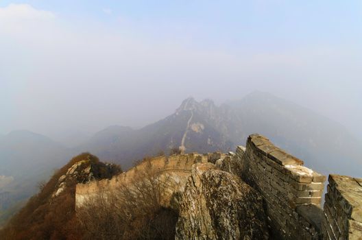 ruins of great wall of china on a foggy day