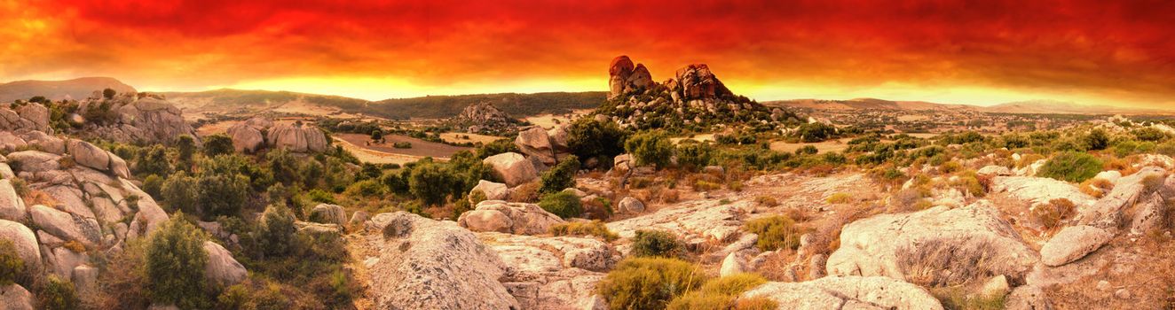 Beautiful sunset over the Moon Valley rock fomations. Sardinia, Italy. Panoraic picture
