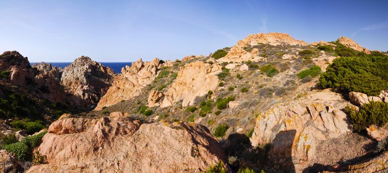 Beautiful bay of red rocks on Sardinia near the village Isola Rossa - panorama