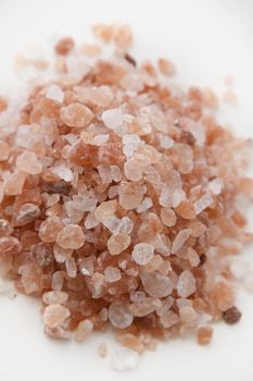 Close up view of a pile of large pink salt grain