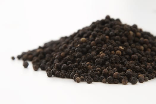 close up view of a mountain of black pepper
