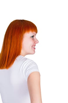 Portrait of a beautiful young redheaded woman looking happy against white background