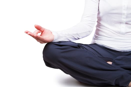 Beautiful young woman is engaged in yoga on a white background