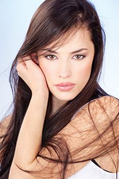 portrait of a pretty young woman with long brunette hair