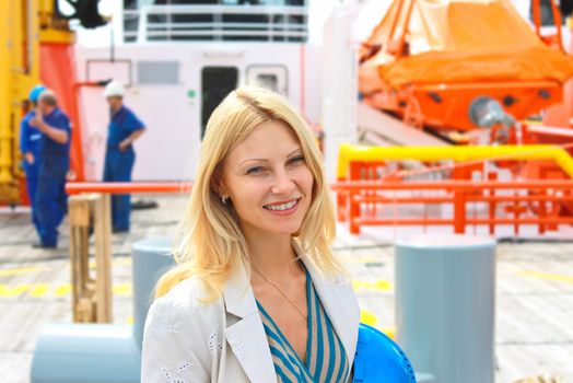 Woman engineer shipbuilder at the shipyard.