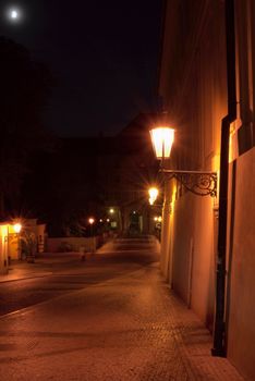 Prague historical street at night.