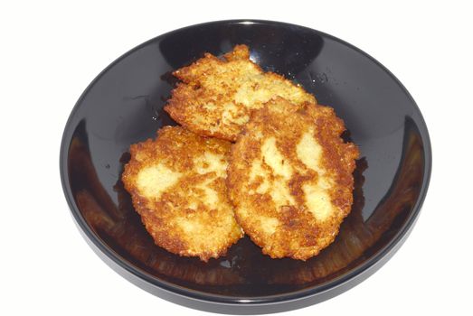 Potato small cakes on the black plate