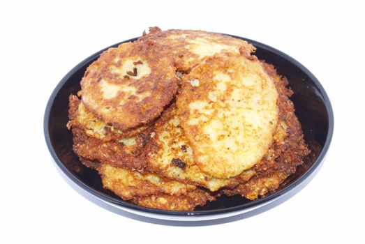 Potato small cakes on the black plate