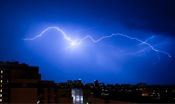 Dazzle lightning over the city at night. Sky before the storm