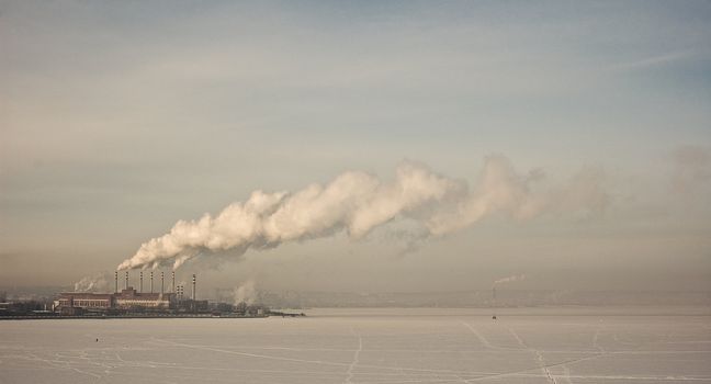 processing plant on the shore of the pond