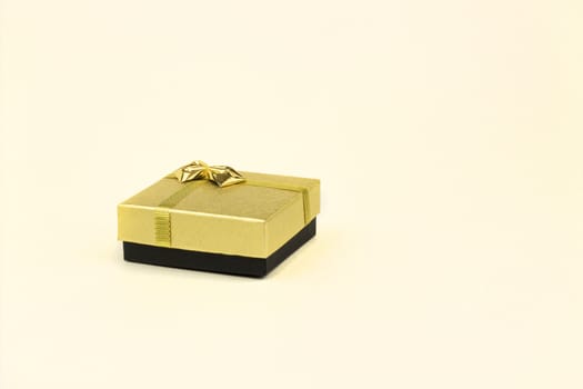 fine image of isolated gift box with golden ribbon