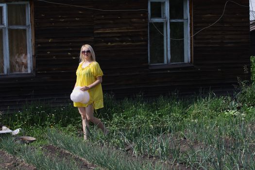 Smiling woman wearing sunglasses in the countryside