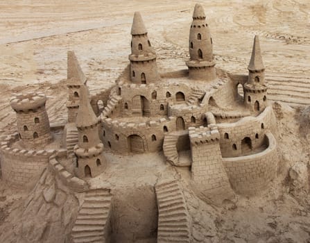 A beautiful sand castle on a beach.