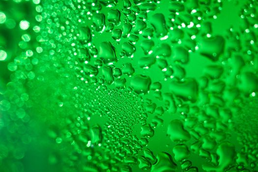 Refreshing green watery background (color toned image; shallow DOF)