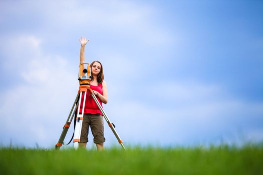 Young land surveyor at work