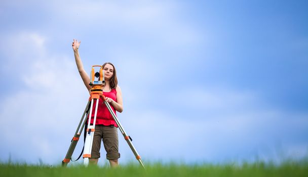 Young land surveyor at work