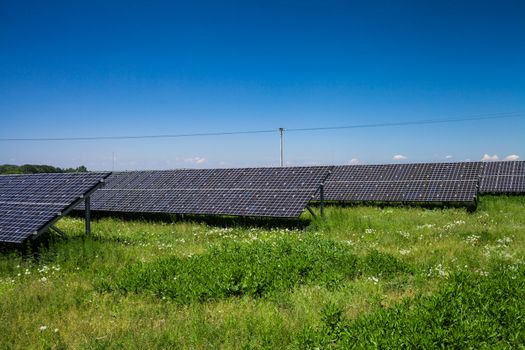 Sunlight as a resource of renewable energy: solar panels on a sunny day