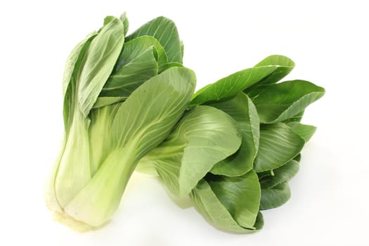 fresh green pak choi on a white background