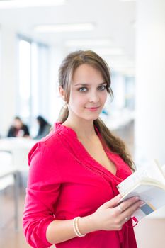 Pretty young college student in a library (shallow DOF; color toned image)