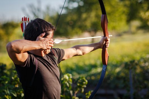 Young archer training with the  bow