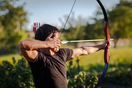 Young archer training with the  bow